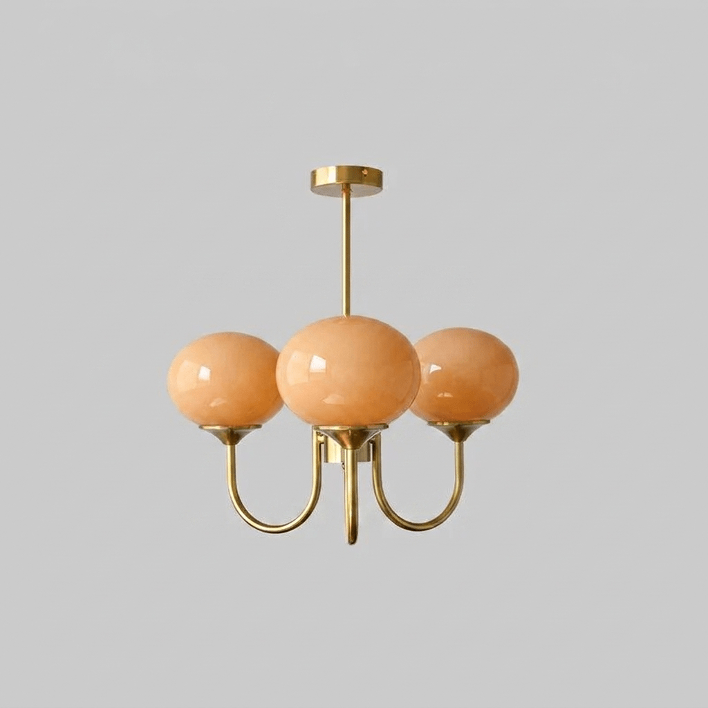 Lustre trois lumières finition cuivre et abat-jours orange