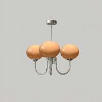 Lustre trois lumières finition chrome et abat-jours orange