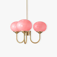 Lustre en verre rose et métal trois lumières sur fond blanc
