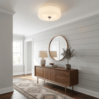 Plafonnier art déco dans une entrée avec console en noyer et miroir rond