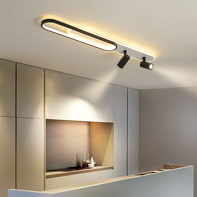 Plafonnier salon LED noir allongé éclairant une cuisine ouverte contemporaine Image