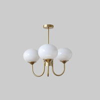 Lustre trois lumières finition cuivre et abat-jours blancs
