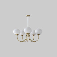 Lustre cinq lumières finition cuivre et abat-jours blancs