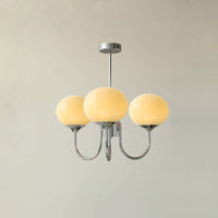 Lustre trois lumières finition chrome et abat-jours crème