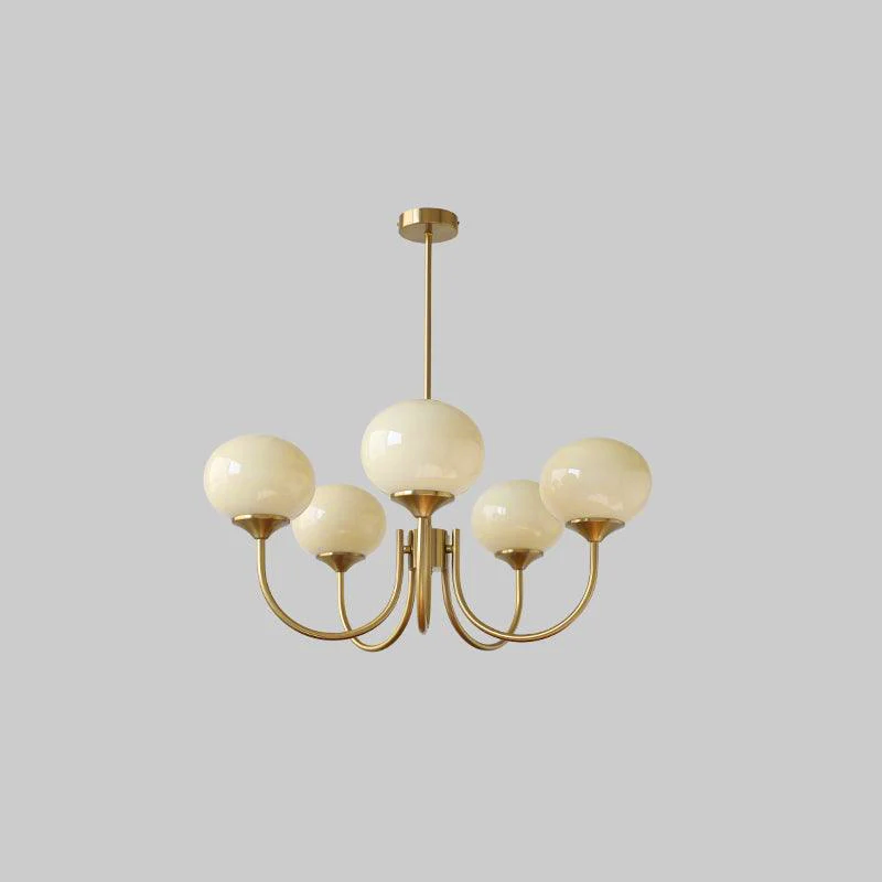 Lustre cinq lumières finition cuivre et abat-jours crème