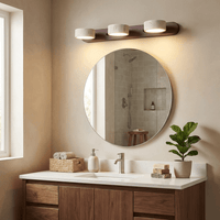 Applique en travertin au-dessus d'un miroir rond de salle de bain