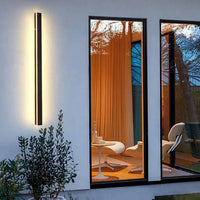 Applique murale extérieure LED minimaliste sur maison design de nuit