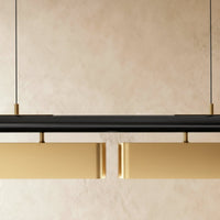 Détail des diffuseurs laiton et de la barre noire du lustre led