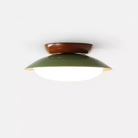 Plafonnier LED vintage marron et vert allumé sur fond blanc