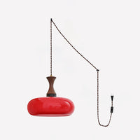 Suspension baladeuse en verre coloris rouge avec cordon et prise